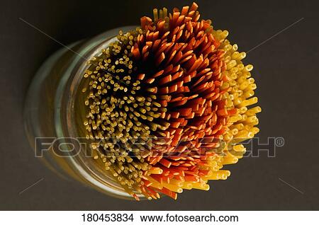 Close-up of raw spaghetti in a jar View Large Photo Image Picture - Close-up of raw spaghetti in a jar. Fotosearch