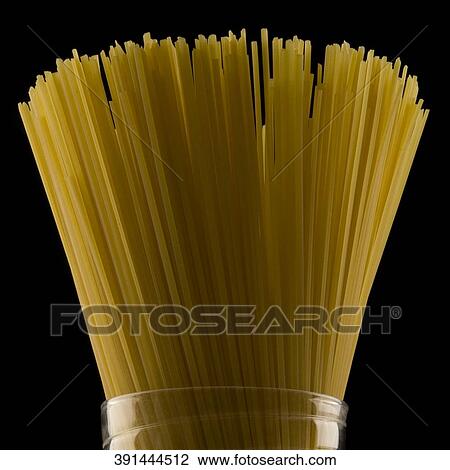 Close-up of raw spaghetti in a jar View Large Photo Image Stock Image - Close-up of raw spaghetti in a jar. Fotosearch