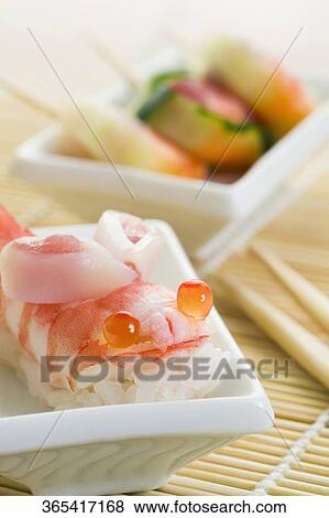 Close-up of shrimp sushi in a bowl View Large Photo Image Stock Photo - Close-up of shrimp sushi in a bowl. Fotosearch