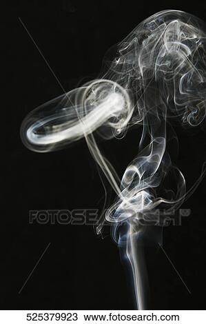 Close-up of smoke against black background View Large Photo Image Stock Image - Close-up of smoke against black background. Fotosearch