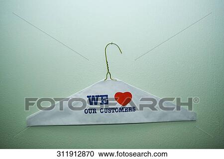 Close-up of text We Love Our Customer painted on a cloth on a hanger, New York City, New York State, USA View Large Photo Image Stock Image - Close-up of text We Love Our Customer painted on a cloth on a hanger, New York City, New York State, USA. Fotosearch