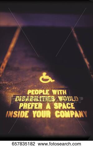 Close-up of text with a disabled sign at a parking lot View Large Photo Image Stock Image - Close-up of text with a disabled sign at a parking lot. Fotosearch