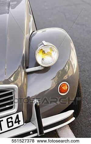 Stock Photo - Close-up of the headlight of a vintage car, Citroen 2CV, Biarritz, Aquitaine, France. Fotosearch