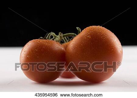 Close-up of tomatoes View Large Photo Image Stock Photograph - Close-up of tomatoes. Fotosearch