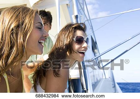 Close-up of two young women smiling View Large Photo Image Picture - Close-up of two young women smiling. Fotosearch
