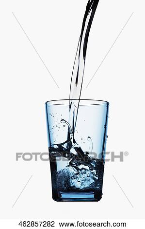 Close-up of water being poured into a glass View Large Photo Image Stock Image - Close-up of water being poured into a glass. Fotosearch