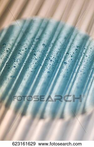 Close-up of water drops on a blue surface View Large Photo Image Stock Photo - Close-up of water drops on a blue surface. Fotosearch