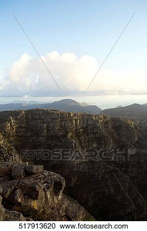 Stock Image - Cloud over mountains. Fotosearch