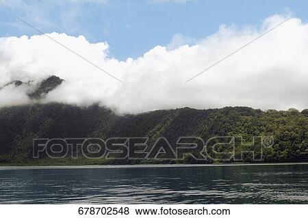 Clouds over a hill, Tahiti, French Polynesia View Large Photo Image Stock Photo - Clouds over a hill, Tahiti, French Polynesia. Fotosearch