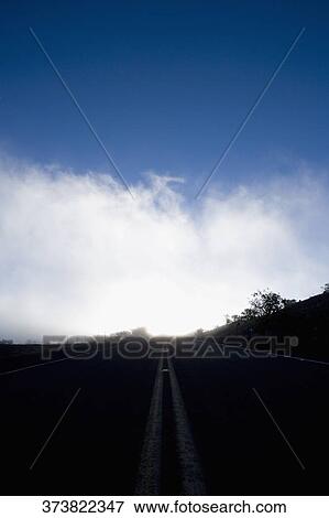 Clouds over an empty road, Mauna Kea, Hilo, Hawaii, USA View Large Photo Image Stock Photo - Clouds over an empty road, Mauna Kea, Hilo, Hawaii, USA. Fotosearch