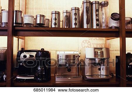 Coffee makers and containers on a rack View Large Photo Image Picture - Coffee makers and containers on a rack. Fotosearch