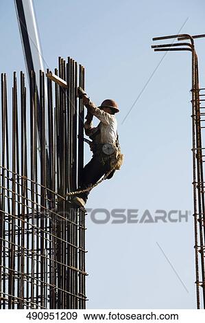 Construction worker at the construction site View Large Photo Image Stock Photo - Construction worker at the construction site. Fotosearch