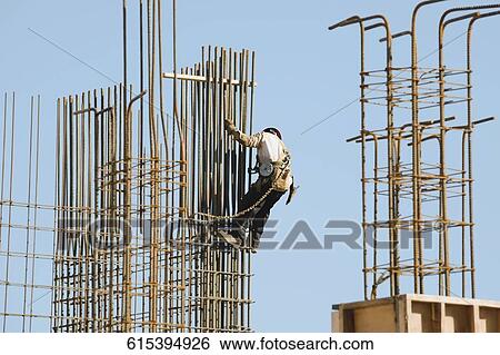 Stock Photograph - Construction worker at the construction site. Fotosearch