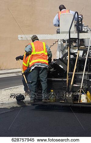 Construction workers with an asphalt paver at a road construction site, Biscayne Boulevard, Miami, Florida, USA View Large Photo Image Stock Photography - Construction workers with an asphalt paver at a road construction site, Biscayne Boulevard, Miami, Florida, USA. Fotosearch
