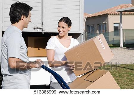 Stock Photo - Couple looking at each other and smiling. Fotosearch