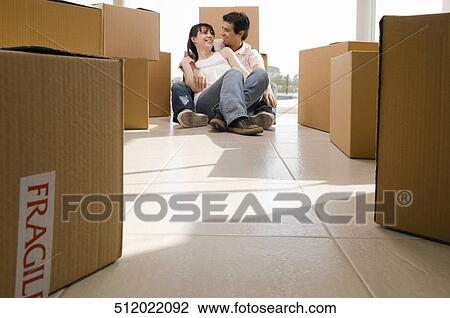 Couple romancing in a new house View Large Photo Image Stock Image - Couple romancing in a new house. Fotosearch