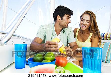 Couple sitting on the ship and having breakfast View Large Photo Image Stock Photo - Couple sitting on the ship and having breakfast. Fotosearch
