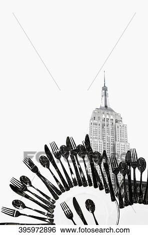 Cutleries superimposed on a building, Empire State Building, Manhattan, New York City, New York State, USA View Large Photo Image Stock Photograph - Cutleries superimposed on a building, Empire State Building, Manhattan, New York City, New York State, USA. Fotosearch