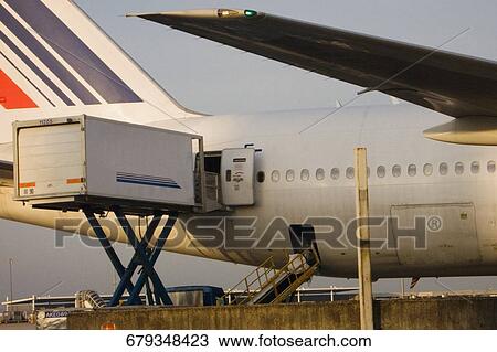 Deck loading in an airplane, Paris, Ile-de-France, France View Large Photo Image Stock Image - Deck loading in an airplane, Paris, Ile-de-France, France. Fotosearch