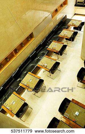 Empty chairs in a hotel View Large Photo Image Stock Photo - Empty chairs in a hotel. Fotosearch