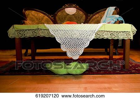Empty table and a couch in a living room View Large Photo Image Stock Image - Empty table and a couch in a living room. Fotosearch