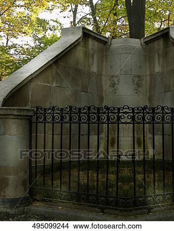 Picture - Fence in front of a structure. Fotosearch