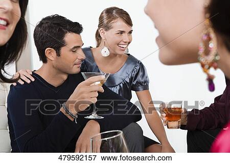 Five friends celebrating with wine and cocktail View Large Photo Image Stock Photo - Five friends celebrating with wine and cocktail. Fotosearch