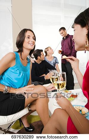 Five friends celebrating with wine and cocktail View Large Photo Image Stock Photo - Five friends celebrating with wine and cocktail. Fotosearch