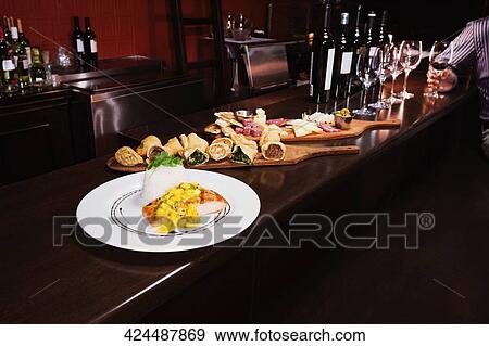 Stock Photo - Food at a bar counter. Fotosearch