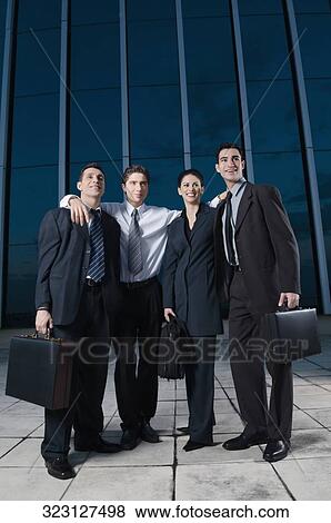 Four business executives smiling together View Large Photo Image Stock Photo - Four business executives smiling together. Fotosearch