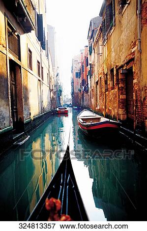 Stock Photo - Gondola and boats in a canal, Grand Canal, Venice, Veneto, Italy. Fotosearch