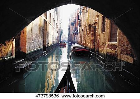 Stock Photograph - Gondola and boats in a canal, Grand canal, Venice, Veneto, Italy. Fotosearch