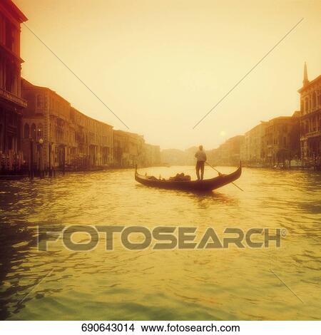 Gondolier rowing a gondola, Grand Canal, Venice, Veneto, Italy View Large Photo Image Picture - Gondolier rowing a gondola, Grand Canal, Venice, Veneto, Italy. Fotosearch