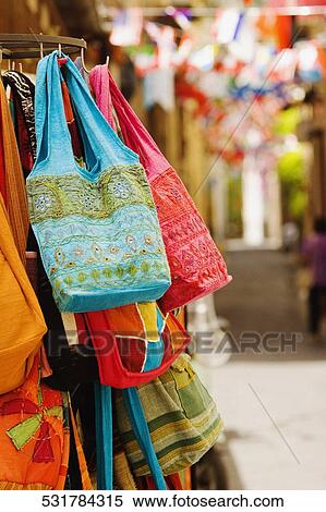 Hand bags hanging at a market stall, Sorrento, Sorrentine Peninsula, Naples Province, Campania, Italy View Large Photo Image Stock Photography - Hand bags hanging at a market stall, Sorrento, Sorrentine Peninsula, Naples Province, Campania, Italy. Fotosearch