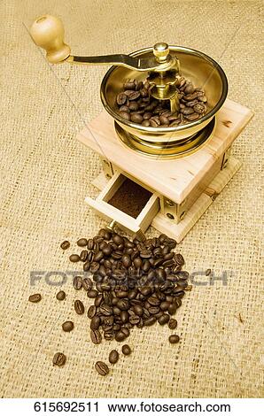 High angle view of a coffee grinder with coffee beans View Large Photo Image Stock Image - High angle view of a coffee grinder with coffee beans. Fotosearch