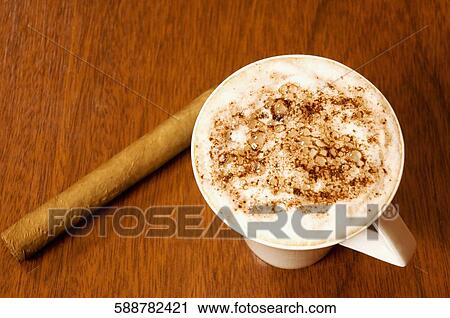 High angle view of a cup of cappuccino with a breadstick View Large Photo Image Stock Image - High angle view of a cup of cappuccino with a breadstick. Fotosearch