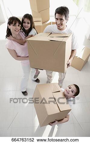 High angle view of a family carrying cardboard boxes View Large Photo Image Stock Image - High angle view of a family carrying cardboard boxes. Fotosearch