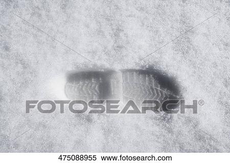 High angle view of a footprint in snow View Large Photo Image Stock Photography - High angle view of a footprint in snow. Fotosearch