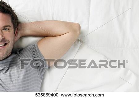 High angle view of a mid adult man smiling View Large Photo Image Stock Image - High angle view of a mid adult man smiling. Fotosearch