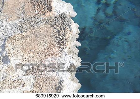 High angle view of a natural geyser, Old Faithful, Upper Geyser Basin, Yellowstone National Park, Wyoming, USA View Large Photo Image Stock Photo - High angle view of a natural geyser, Old Faithful, Upper Geyser Basin, Yellowstone National Park, Wyoming, USA. Fotosearch