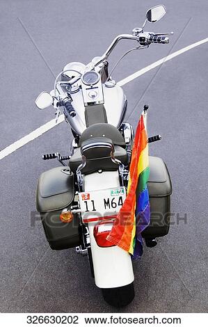 High angle view of a rainbow flag on a motorcycle View Large Photo Image Stock Image - High angle view of a rainbow flag on a motorcycle. Fotosearch