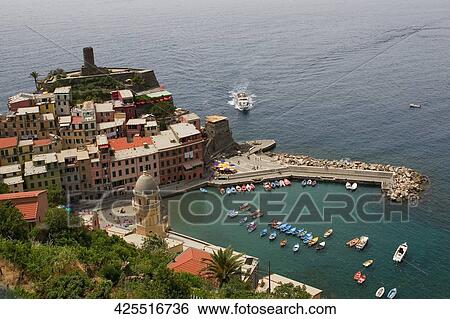 High angle view of a town at a seaside, Doria Castle, Italian Riviera, Cinque Terre National Park, Vernazza, La Spezia, Liguria, Italy View Large Photo Image Stock Photograph - High angle view of a town at a seaside, Doria Castle, Italian Riviera, Cinque Terre National Park, Vernazza, La Spezia, Liguria, Italy. Fotosearch