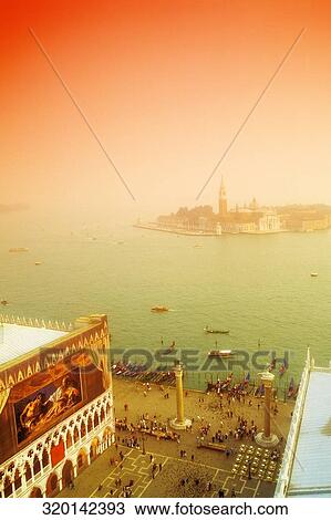 Stock Image - High angle view of a town square, St. Mark's Square, San Giorgio Maggiore, Venice, Veneto, Italy. Fotosearch