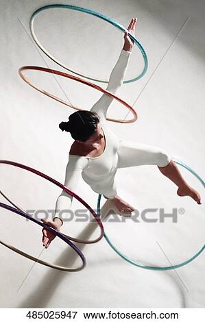 High angle view of a woman exercising with hula hoops View Large Photo Image Stock Photo - High angle view of a woman exercising with hula hoops. Fotosearch