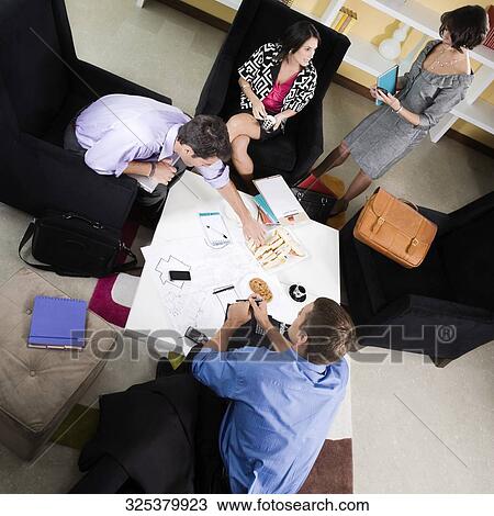 High angle view of business executives discussing View Large Photo Image Stock Image - High angle view of business executives discussing. Fotosearch