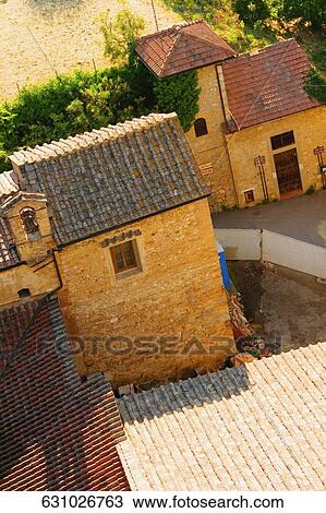 Stock Image - High angle view of houses, San Gimignano, Siena Province, Tuscany, Italy. Fotosearch