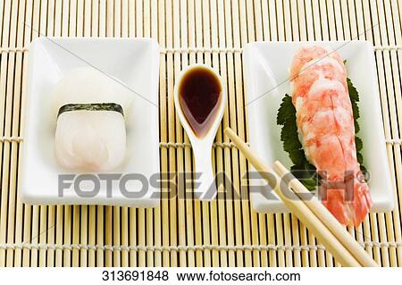 High angle view of one plate of sushi and one plate of lobster View Large Photo Image Stock Photo - High angle view of one plate of sushi and one plate of lobster. Fotosearch