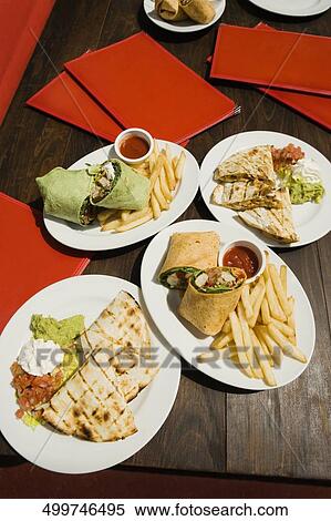 High angle view of pie and french fries in plates View Large Photo Image Stock Photography - High angle view of pie and french fries in plates. Fotosearch