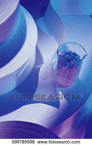 Stock Photo - High angle view of rolls of ribbon with a pitcher. Fotosearch