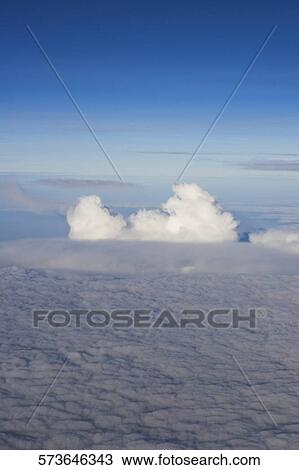 High angle view of sea of clouds View Large Photo Image Stock Image - High angle view of sea of clouds. Fotosearch